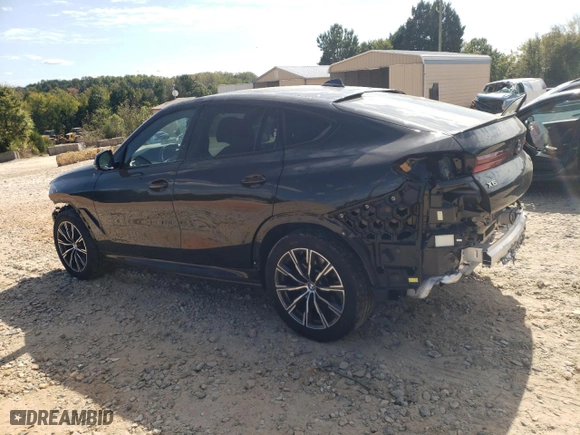2021 BMW X6 M50i with VIN 5UXCY8C06M9F17046, listed as a Copart auction lot 76242764 with 32,689 mi miles and Salvage Title. Bid and sale history available at carsss.com. Image 2.