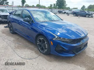 2023 Kia K5 GT-Line z VIN 5XXG64J21PG226030, wystawiony jako IAAI lot #42277192 z przebiegiem 5 512 mil mil oraz . Historia ofert i sprzedaży dostępna na DreamBid. Obrazek 1.