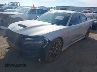 2019 Dodge Charger Scat Pack with VIN 2C3CDXGJXKH599632, listed as a IAAI auction lot 41666680 with 116,995 mi miles and . Bid and sale history available at DreamBid. Image 18.