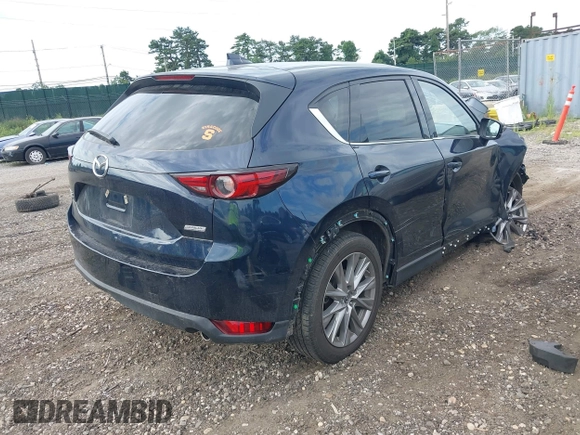 2019 Mazda CX-5 Grand Touring with VIN JM3KFBDM8K1521231, listed as a IAAI auction lot 42738963 with 32,179 mi miles and . Bid and sale history available at DreamBid. Image 4.