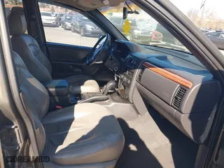 1999 Jeep Grand Cherokee Laredo with VIN 1J4GW58NXXC623753, listed as a IAAI auction lot 41685540 with 190,134 mi miles. Bid and sale history available at carsss.com. Image 5.