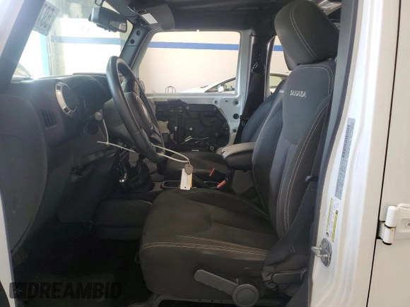 2016 Jeep Wrangler Unlimited Sahara with VIN 1C4BJWEGXGL310499, listed as a Copart auction lot 59756015 with 128,498 mi miles and Salvage title. Bid and sale history available at DreamBid. Image 7.