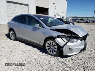 2016 Tesla Model X 70D with VIN 5YJXCAE29GF004033, listed as a Copart auction lot 49673975 with 220,259 mi miles and Salvage Title. Bid and sale history available at DreamBid. Image 4.