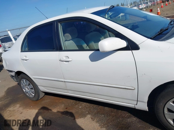 2004 Toyota Corolla CE with VIN JTDBR32E540051928, listed as a IAAI auction lot 41958483 with 299,999 mi miles. Bid and sale history available at carsss.com. Image 14.
