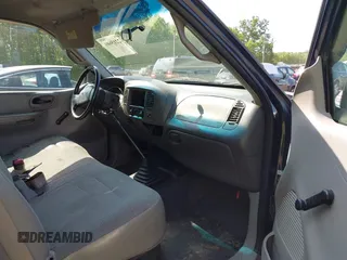 2000 Ford F-150 XL with VIN 1FTZX1723YNB00043, listed as a IAAI auction lot 42215601 with Not provided miles and . Bid and sale history available at DreamBid. Image 5.