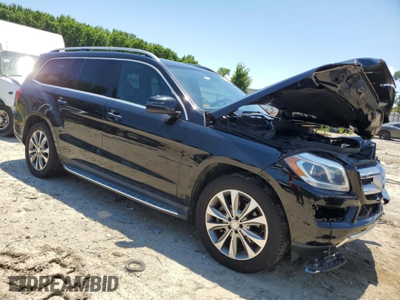 2015 Mercedes-Benz GL with VIN 4JGDF6EE1FA562088, listed as a Copart auction lot 58736934 with 104,550 mi miles and Salvage Title. Bid and sale history available at carsss.com. Image 4.