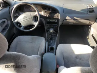 2001 Kia Sephia z VIN KNAFB121715014673, wystawiony jako Copart lot #71712174 z przebiegiem 83 277 mil mil oraz Szkody całkowita. Historia ofert i sprzedaży dostępna na DreamBid. Obrazek 8.