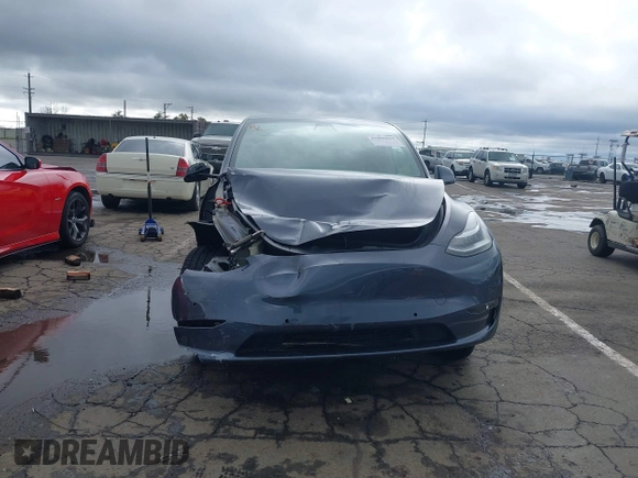 2022 Tesla Model Y Long Range with VIN 7SAYGDEE8NF317482, listed as a IAAI auction lot 41806043 with 32,108 mi miles and . Bid and sale history available at carsss.com. Image 13.
