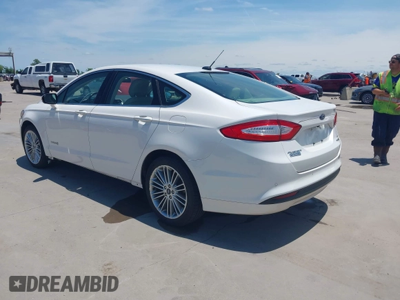 2014 Ford Fusion SE Hybrid with VIN 3FA6P0LUXER233658, listed as a IAAI auction lot 42311588 with 106,282 mi miles and . Bid and sale history available at DreamBid. Image 3.