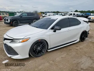 2018 Toyota Camry LE with VIN 4T1B11HK9JU002160, listed as a Copart auction lot 58702125 with 147,064 mi miles and Salvage title. Bid and sale history available at DreamBid. Image 1.