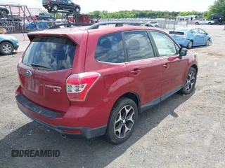 2014 Subaru Forester XT Touring with VIN JF2SJGMC1EH500150, listed as a IAAI auction lot 42201409 with 106,728 mi miles and . Bid and sale history available at DreamBid. Image 4.
