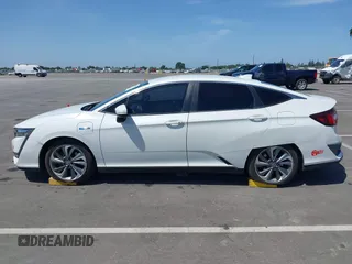 2018 Honda Clarity z VIN JHMZC5F10JC015706, wystawiony jako IAAI lot #42290573 z przebiegiem 158 987 mil mil oraz . Historia ofert i sprzedaży dostępna na DreamBid. Obrazek 14.