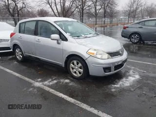 2009 Nissan Versa 1.8 SL with VIN 3N1BC13E59L420840, listed as a IAAI auction lot 41503232 with 129,824 mi miles. Bid and sale history available at carsss.com. Image 1.