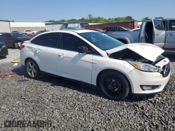 2016 Ford Focus Titanium z VIN 1FADP3J25GL201003, wystawiony jako Copart lot #53799745 z przebiegiem 194 055 mil mil oraz Szkoda całkowita • Salvage title. Historia ofert i sprzedaży dostępna na DreamBid. Obrazek 4.