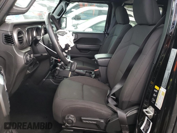 2023 Jeep Wrangler Sport with VIN 1C4HJXDN9PW638737, listed as a Copart auction lot 71367284 with 12,054 mi miles and Salvage Title. Bid and sale history available at DreamBid. Image 7.