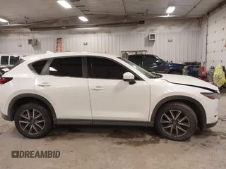 2018 Mazda CX-5 S Premium with VIN JM3KFBDM1J1412088, listed as a IAAI auction lot 41497431 with 65,532 mi miles and . Bid and sale history available at DreamBid. Image 13.
