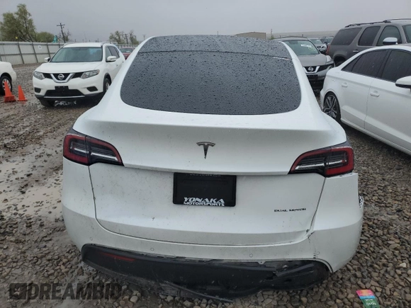 2020 Tesla Model Y Long Range z VIN 5YJYGDEE4LF052702, wystawiony jako Copart lot #53243385 z przebiegiem 75 917 mil mil oraz Szkoda całkowita • Salvage title. Historia ofert i sprzedaży dostępna na DreamBid. Obrazek 6.