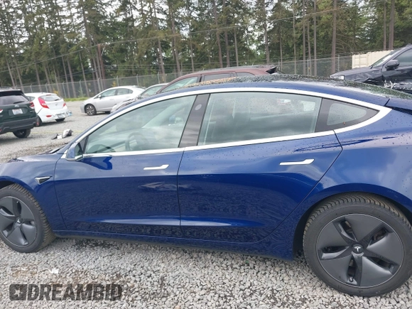 2018 Tesla Model 3 Long Range Battery z VIN 5YJ3E1EBXJF092025, wystawiony jako IAAI lot #42268369 z przebiegiem 132 687 mil mil oraz . Historia ofert i sprzedaży dostępna na DreamBid. Obrazek 15.