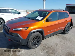 2016 Jeep Cherokee Trailhawk with VIN 1C4PJMBBXGW251682, listed as a IAAI auction lot 41973696 with 100,411 mi miles. Bid and sale history available at carsss.com. Image 18.