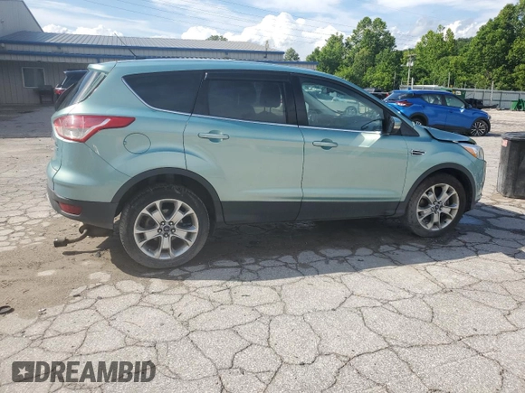 2013 Ford Escape SEL z VIN 1FMCU9H98DUC56048, wystawiony jako Copart lot #61613085 z przebiegiem 198 102 mil mil oraz Szkoda całkowita • Salvage title. Historia ofert i sprzedaży dostępna na DreamBid. Obrazek 3.