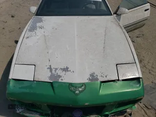 1991 Pontiac Firebird z VIN 1G2FS23E5ML239639, wystawiony jako Copart lot #54986095 z przebiegiem 154 017 mil mil oraz Tytuł czysty. Historia ofert i sprzedaży dostępna na DreamBid. Obrazek 11.