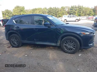 2017 Mazda CX-5 Touring with VIN JM3KFBCL6H0170455, listed as a IAAI auction lot 40381242 with 71,520 mi miles. Bid and sale history available at carsss.com. Image 13.