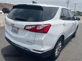 2019 Chevrolet Equinox LT z VIN 2GNAXTEV9K6199184, wystawiony jako IAAI lot #42545110 z przebiegiem 56 143 mil mil oraz . Historia ofert i sprzedaży dostępna na DreamBid. Obrazek 4.