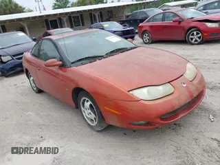 2002 Saturn SC z VIN 1G8ZR12742Z146956, wystawiony jako IAAI lot #42175290 z przebiegiem Nie podano mil oraz . Historia ofert i sprzedaży dostępna na DreamBid. Obrazek 1.