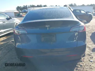 2023 Tesla Model Y Long Range with VIN 7SAYGDEE1PF647841, listed as a IAAI auction lot 41156390 with 33,473 mi miles. Bid and sale history available at carsss.com. Image 15.