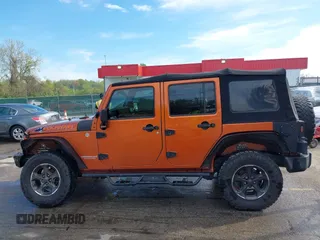 2010 Jeep Wrangler Unlimited Sport with VIN 1J4HA3H1XAL189667, listed as a IAAI auction lot 42062351 with 144,838 mi miles. Bid and sale history available at carsss.com. Image 14.