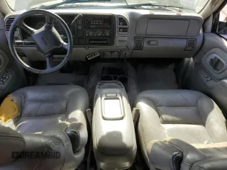 1999 GMC Yukon with VIN 1GKEC13R9XJ704929, listed as a Copart auction lot 89097295 with 87,478 mi miles and Salvage Title. Bid and sale history available at carsss.com. Image 8.