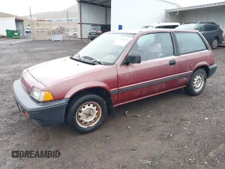 1987 Honda Civic z VIN JHMEC3427HS028239, wystawiony jako IAAI lot #41728725 z przebiegiem 113 710 mil mil oraz . Historia ofert i sprzedaży dostępna na DreamBid. Obrazek 2.