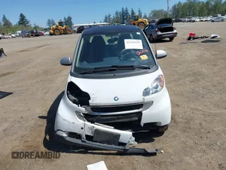 2012 Smart fortwo Pure z VIN WMEEJ3BAXCK563660, wystawiony jako IAAI lot #42165195 z przebiegiem 53 809 mil mil oraz . Historia ofert i sprzedaży dostępna na DreamBid. Obrazek 13.