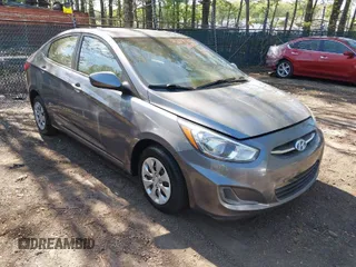 2015 Hyundai Accent GLS with VIN KMHCT4AEXFU912878, listed as a IAAI auction lot 42074122 with 137,526 mi miles. Bid and sale history available at carsss.com. Image 1.