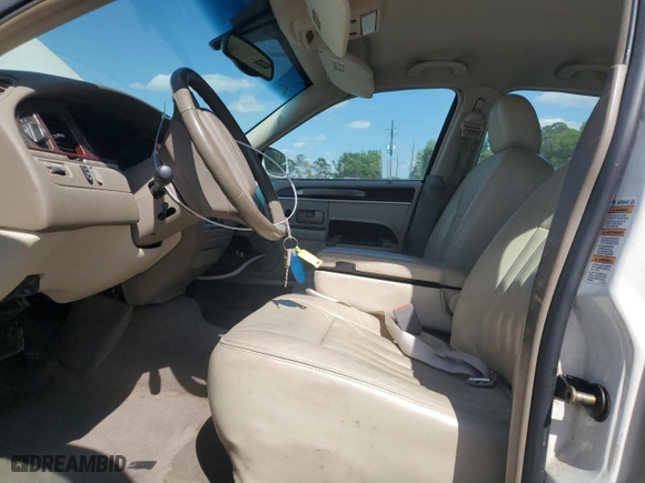 2004 Lincoln Town Car Signature with VIN 1LNHM81W04Y603672, listed as a Copart auction lot 52566725 with 214,180 mi miles and Salvage Title. Bid and sale history available at carsss.com. Image 7.