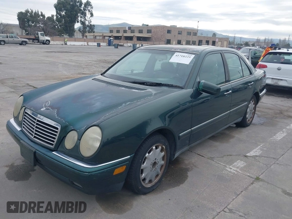 1997 Mercedes-Benz E-Class with VIN WDBJF55F3VJ034009, listed as a IAAI auction lot 41710225 with 239,673 mi miles. Bid and sale history available at carsss.com. Image 6.