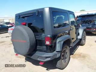 2015 Jeep Wrangler Rubicon Hard Rock with VIN 1C4BJWCG1FL610028, listed as a IAAI auction lot 42318569 with 48,627 mi miles and . Bid and sale history available at DreamBid. Image 4.