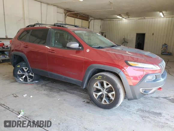 2015 Jeep Cherokee Trailhawk with VIN 1C4PJMBS1FW745928, listed as a Copart auction lot 62032585 with 132,559 mi miles and Salvage title. Bid and sale history available at DreamBid. Image 4.