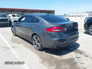2020 Ford Fusion Titanium with VIN 3FA6P0K96LR173971, listed as a IAAI auction lot 42232469 with 82,474 mi miles and . Bid and sale history available at DreamBid. Image 3.