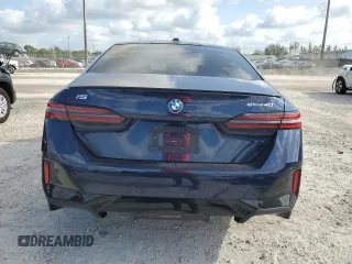 2024 BMW i5 eDrive40 with VIN WBY33FK09RCR50159, listed as a Copart auction lot 55520615 with 12,564 mi miles and Salvage title. Bid and sale history available at DreamBid. Image 6.