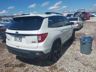 2019 Honda Passport Elite z VIN 5FNYF8H0XKB000774, wystawiony jako IAAI lot #42153669 z przebiegiem 65 415 mil mil oraz . Historia ofert i sprzedaży dostępna na DreamBid. Obrazek 4.