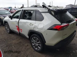 2022 Toyota RAV4 XLE Premium z VIN 2T3A1RFV1NW312419, wystawiony jako IAAI lot #42361686 z przebiegiem 14 291 mil mil oraz . Historia ofert i sprzedaży dostępna na DreamBid. Obrazek 3.