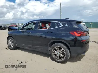 2022 BMW X2 sDrive28i with VIN WBXYH9C0XN5T86256, listed as a Copart auction lot 74173554 with 35,658 mi miles and Salvage Title. Bid and sale history available at carsss.com. Image 2.