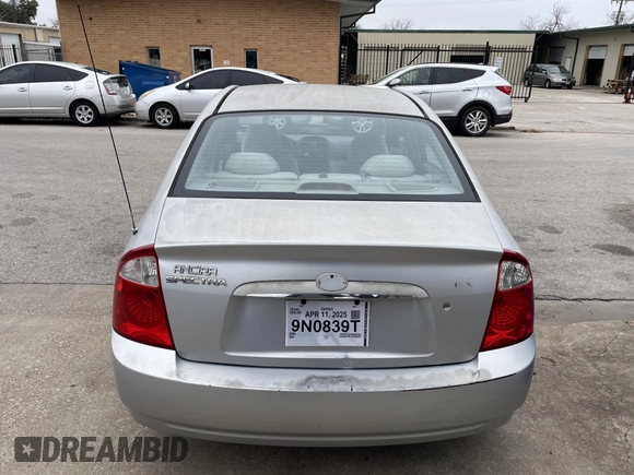 2004 Kia Spectra LX with VIN KNAFE121845043143, listed as a IAAI auction lot 41574523 with 211,758 mi miles. Bid and sale history available at carsss.com. Image 12.