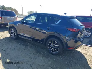 2018 Mazda CX-5 Grand Touring with VIN JM3KFADM1J0322049, listed as a IAAI auction lot 41891079 with 174,939 mi miles and . Bid and sale history available at DreamBid. Image 3.