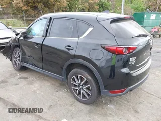2018 Mazda CX-5 Grand Touring with VIN JM3KFBDM1J0358197, listed as a IAAI auction lot 41967940 with 148,119 mi miles and . Bid and sale history available at DreamBid. Image 3.