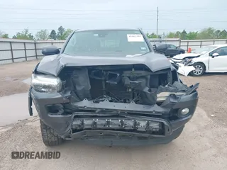 2018 Toyota Tacoma SR5 with VIN 5TFAZ5CN5JX062498, listed as a IAAI auction lot 41867393 with 128,879 mi miles and . Bid and sale history available at DreamBid. Image 6.