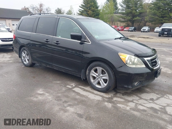 2010 Honda Odyssey Touring with VIN 5FNRL3H97AB056975, listed as a IAAI auction lot 42169269 with 183,483 mi miles. Bid and sale history available at carsss.com. Image 1.