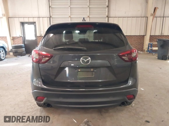 2016 Mazda CX-5 Grand Touring with VIN JM3KE2DYXG0846787, listed as a IAAI auction lot 41346364 with 113,553 mi miles. Bid and sale history available at carsss.com. Image 16.