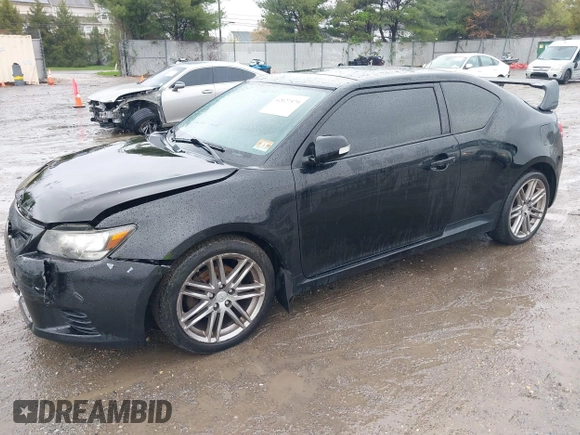 2013 Scion tC with VIN JTKJF5C79D3051664, listed as a IAAI auction lot 42027579 with 211,322 mi miles. Bid and sale history available at carsss.com. Image 2.